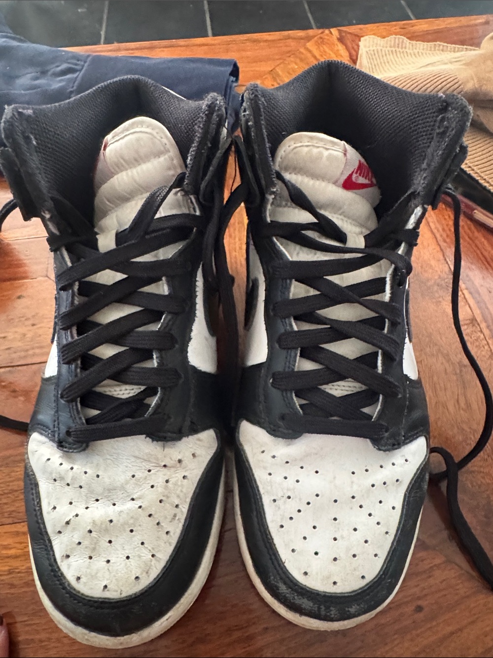Nike Black and White High-Top Sneakers with Red Logo